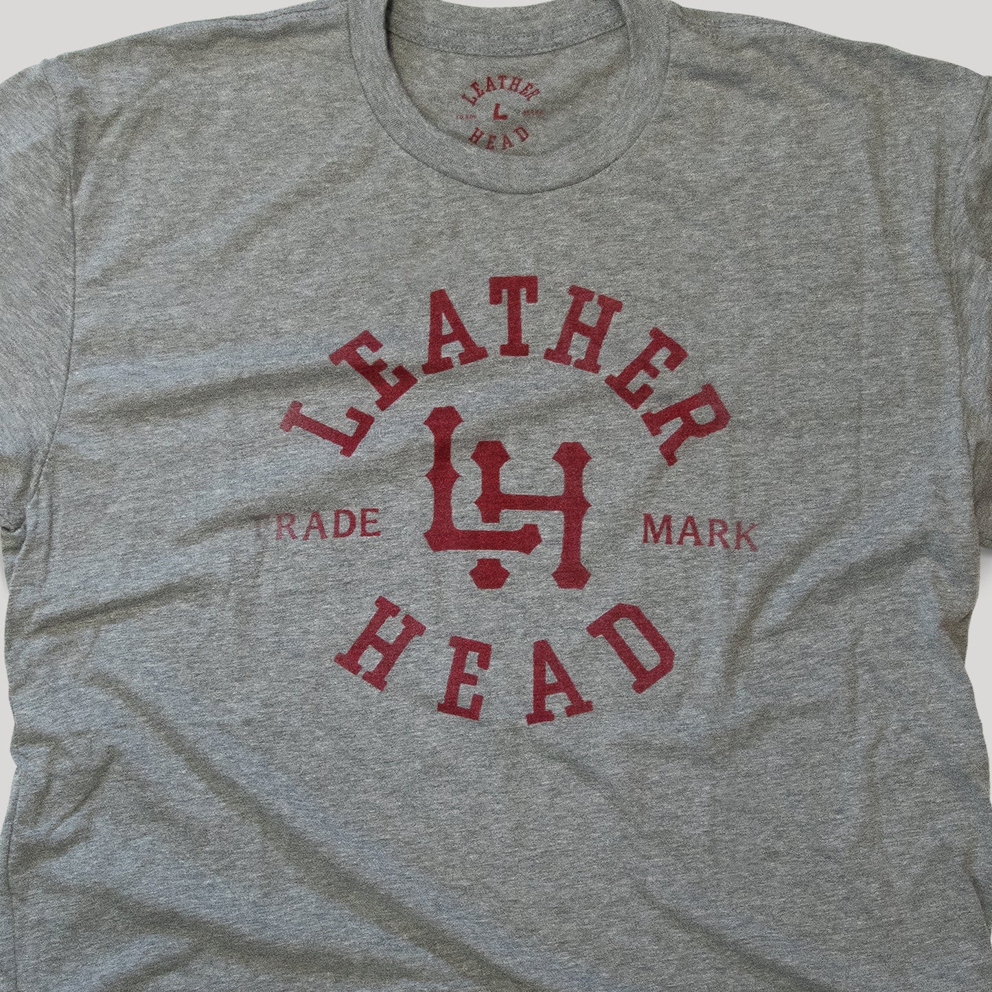
                  
                    Leather Head Logo Tee Shirt - Light Grey
                  
                